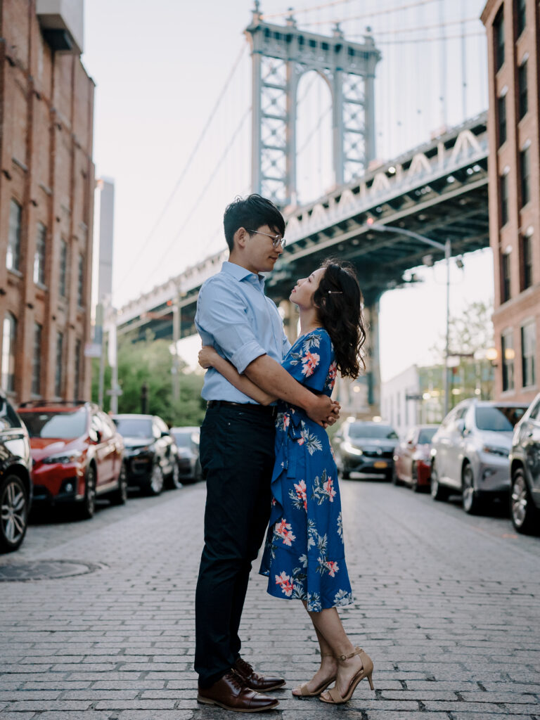 5 best DUMBO Brooklyn photography locations. Engagement Photo under the Manhattan Bridge