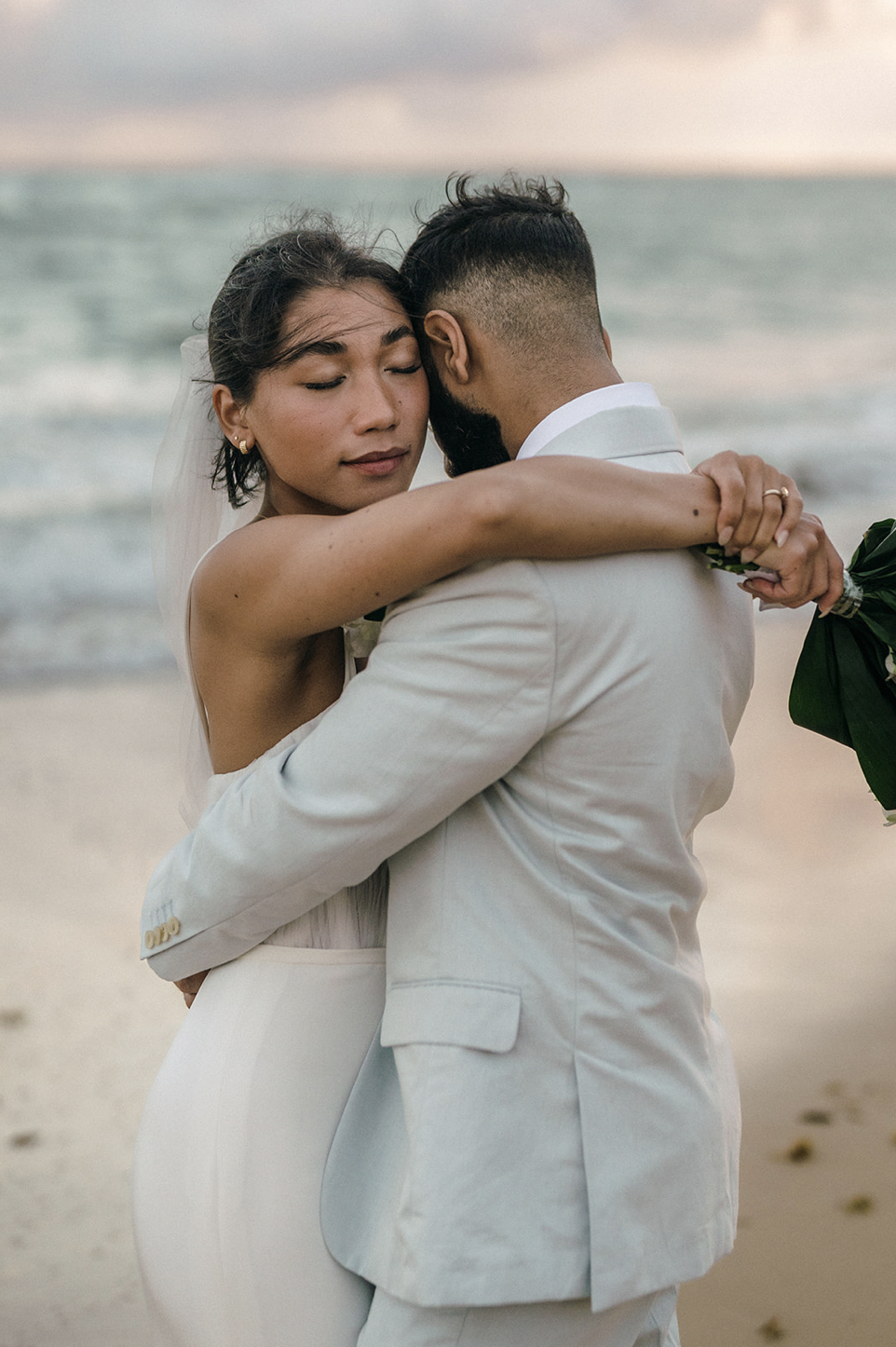 Bride and groom sharing an embrace during their wedding shoot in Punta Cana with For Fearless Hearts
