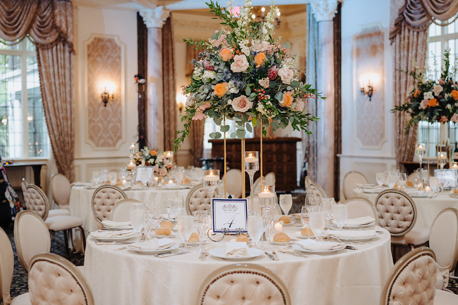 Pleasantdale Chateau Wedding Cost and Planning Guide. Wedding reception table set up with elegant floral centerpiece.